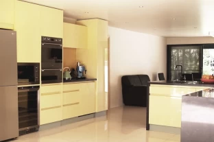 Bright contemporary Handle-less Kitchen with  Caesarstone Waterfall Ends. Recessed Handle Kitchens by Adelaide’s Compass Kitchens for Blackwood, Brighton, Brooklyn Park, Burnside, Eden Hills, Flagstaff Hill, Glenelg, Hallett Cove, Hove, Moana, Morphett Vale, Trott Park, Sheidow Park and Seacliff