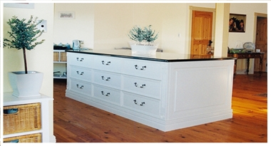 a-white-hand-painted-french-provincial-style-kitchen-island