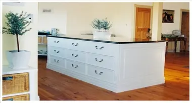 a-white-hand-painted-french-provincial-style-kitchen-island